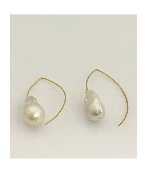 These simply elegant earrings consisting of a single baroque freshwater pearl floating on a wire.